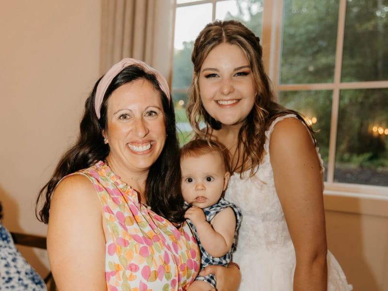Lorraine Stewart (right) was holding her 4-hour-old son, Court (center), when he stopped breathing. Hallie Allison (left) helped save his life with infant CPR. (Photo courtesy of Lindy Picciotti Photography)
